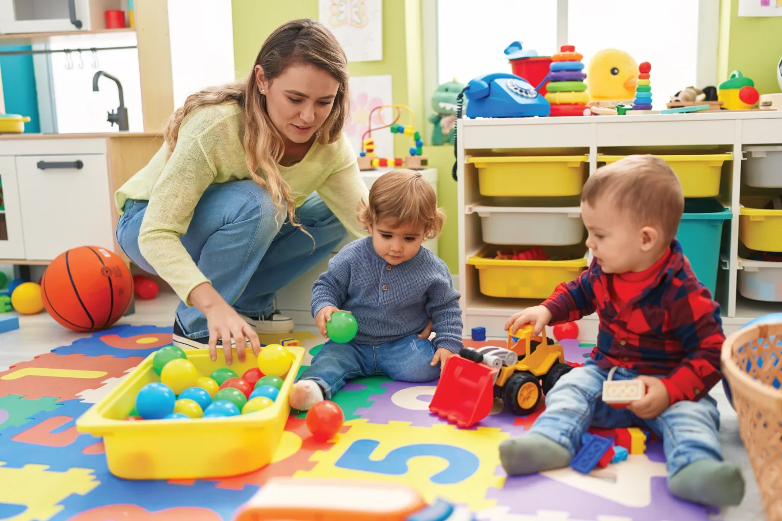Children playing with toys in playroom